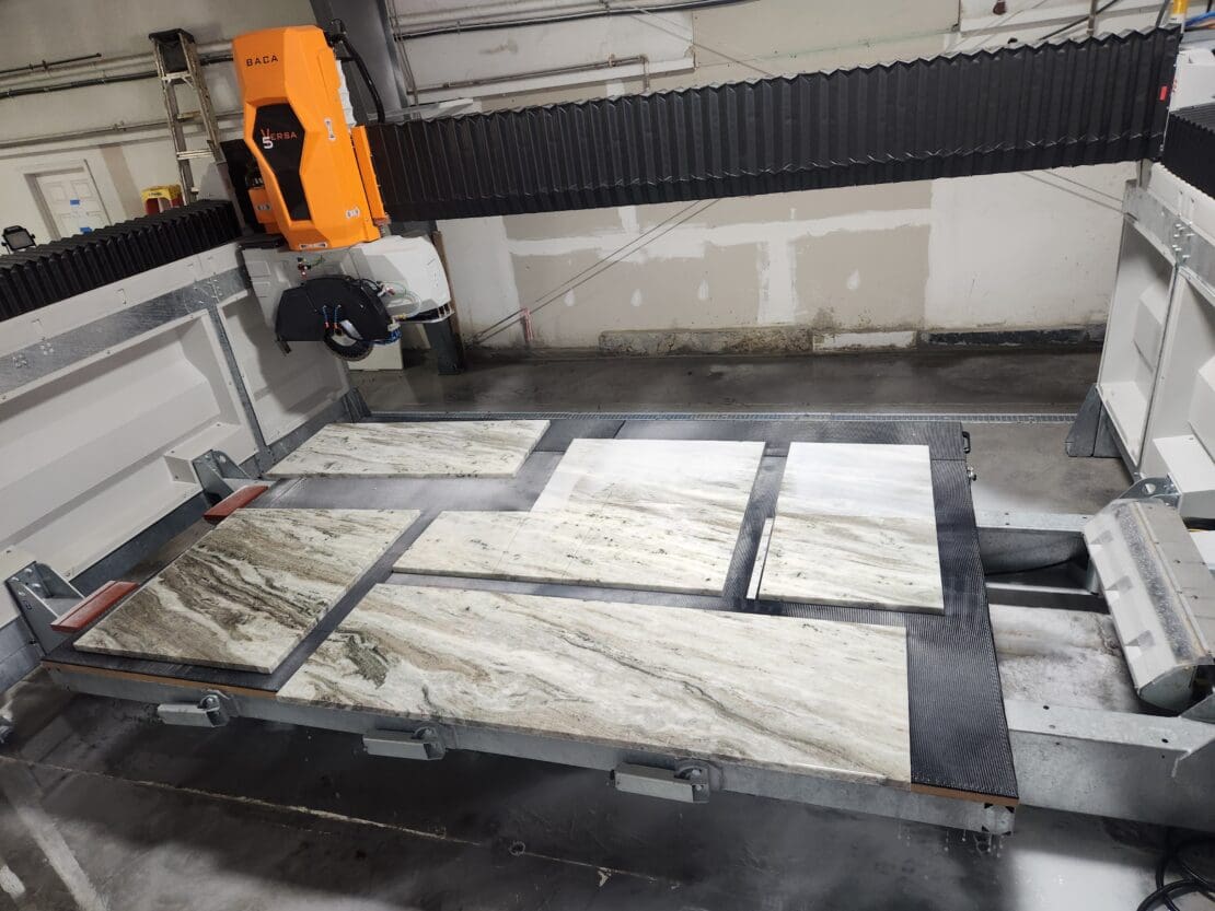The Versa 5 cutting a granite slab into several pieces