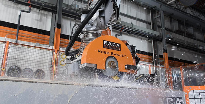 Robo SawJet cutting into stone. Water is splashing everywhere.