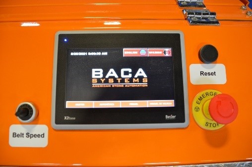 the touch screen of a BACA robotic cutting system. The screen says BACA Systems.