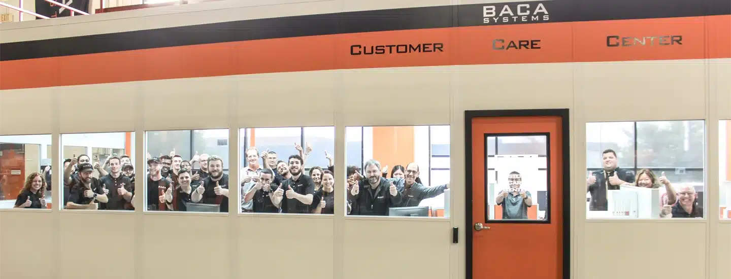Baca Systems Customer Care Center team giving thumbs up, showcasing teamwork and positive customer service atmosphere.