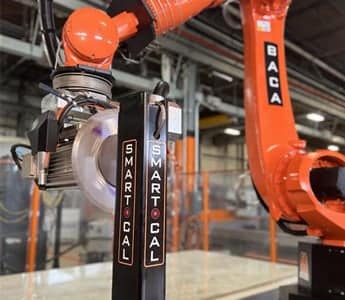 Close-up of BACA Robo SawJet M Series 240 running Smart Cal automated calibration with spinning saw blade at post