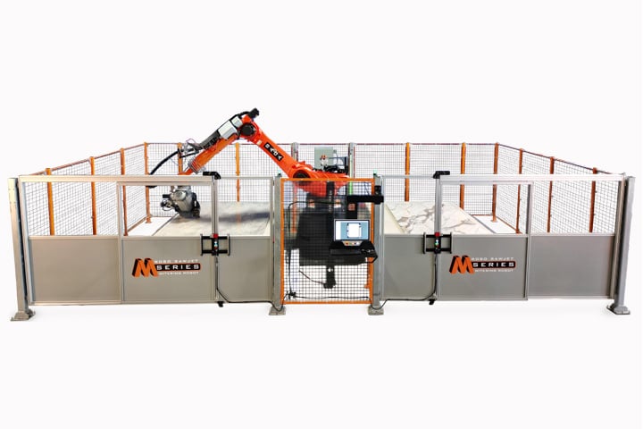 BACA Robo SawJet M Series 240 Dual Table cutting quartzite slab at headquarters with both doors closed